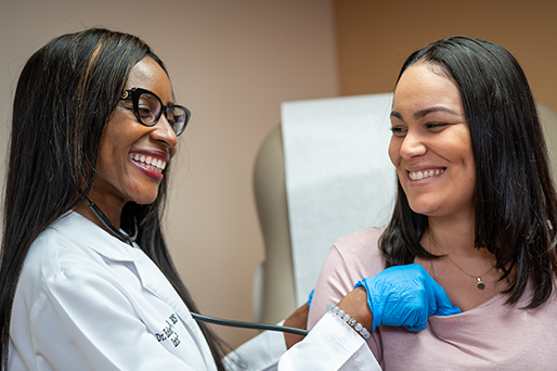 Dr. Helen Chukwu examining Jennifer with stethoscope