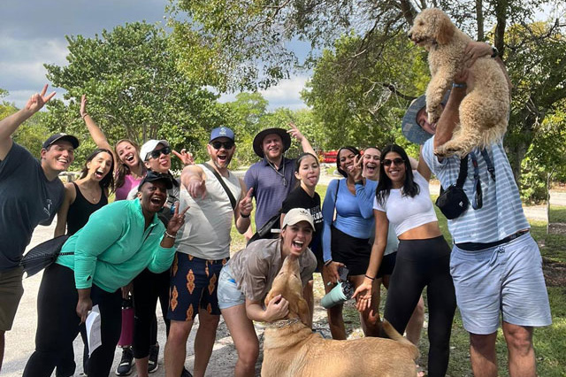 Emergency medicine residents at a park with their pets