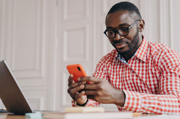 Patient reading text message from healthcare system