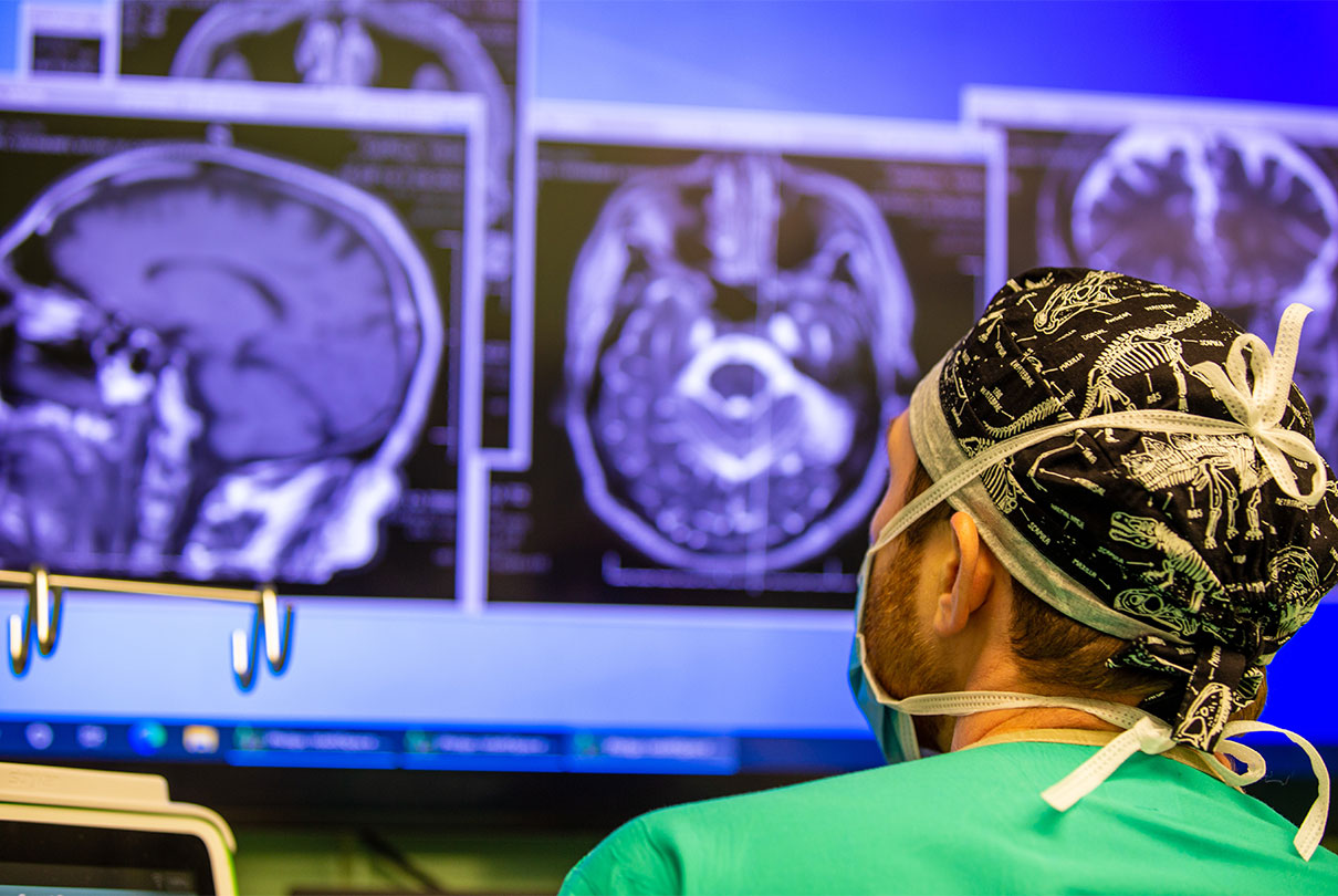 doctor looking at image of brain